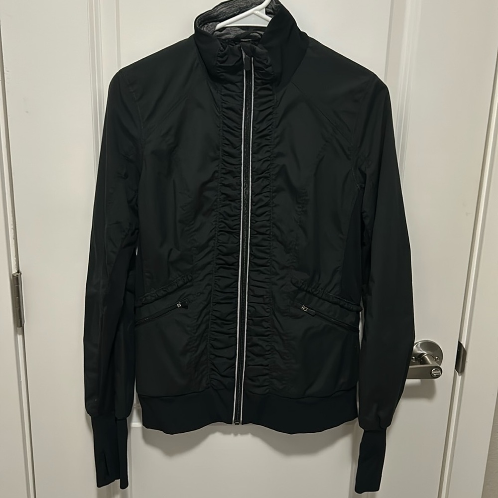 Lululemon lined, windbreaker. Reflective detail at zipper.